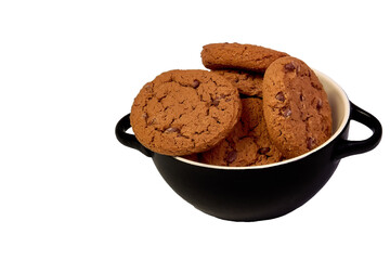 Cookies with cocoa and chocolate chips in a black plate on a white background