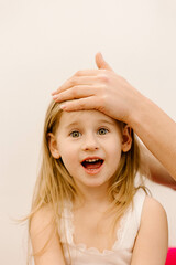 real doctor osteopath hands does physiological and emotional therapy for four year old kid girl....