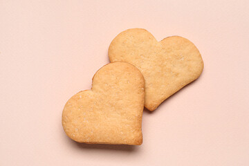 Tasty heart shaped cookies on beige background. Valentines Day celebration