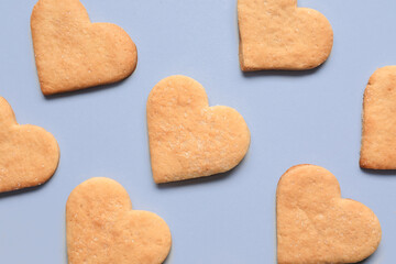 Tasty heart shaped cookies on lilac background. Valentines Day celebration