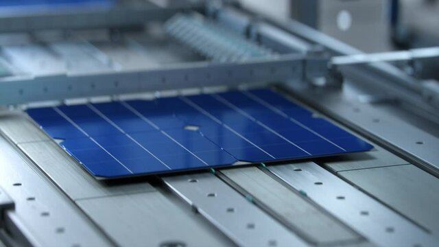 Solar Cells are  Being Moved and Tested on Conveyor during Solar Panel Production Process on Advanced Factory