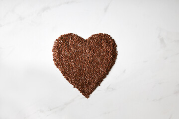 Top view of flaxseed formed into a heart shape