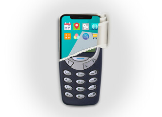Old mobile cell phone is ripped to show new smartphone