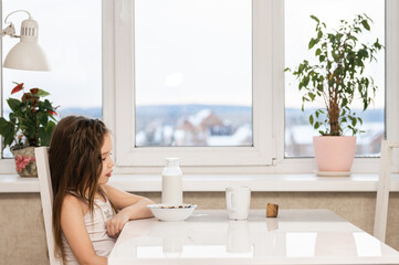 woman looking out window