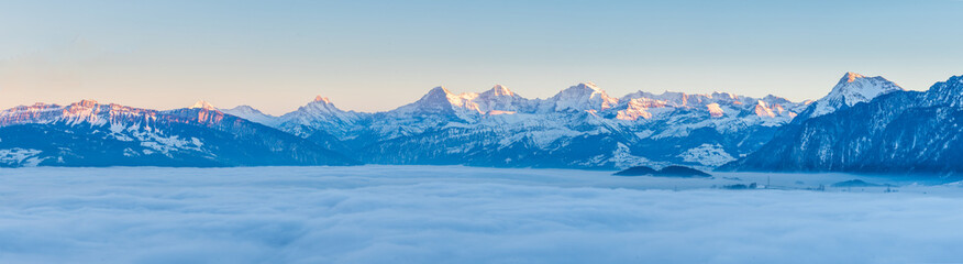 Fototapeta na wymiar winter landscape with swiss mountains and fog
