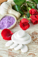 Spa stones on white wooden background. Valentine's Day celebration