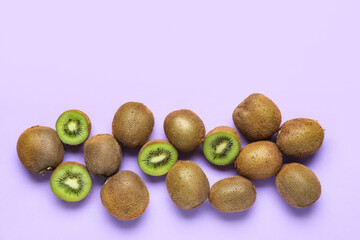 Fresh ripe kiwi on purple background