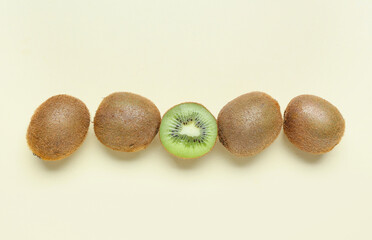 Fresh ripe kiwi on beige background
