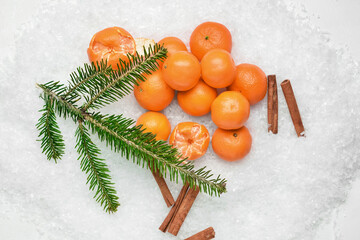 Fototapeta na wymiar Tasty tangerines and snow on snow
