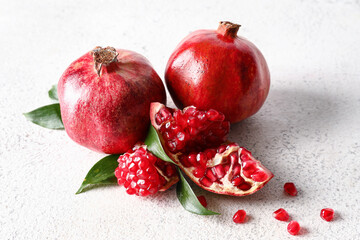 Ripe delicious pomegranate on light background