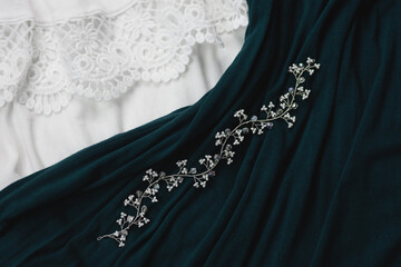 White wedding hair accessory on 
cyan and white background