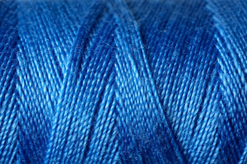 Blue sewing threads as background