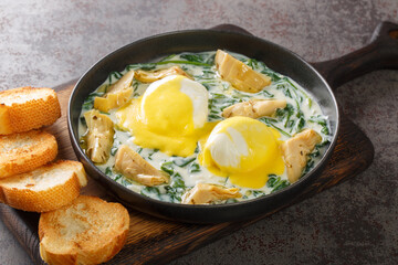 Eggs Sardou New Orleans brunch recipe made with poached eggs, served artichoke and creamed spinach...