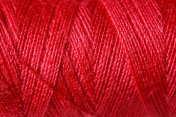 Red sewing threads as background
