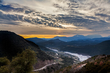 Fototapeta na wymiar Sunset over the valley of Aperantia, in the mountainous region of Evritania, in Central Greece, Europe. 