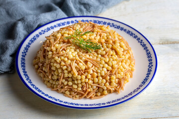 Traditional delicious Turkish food; Couscous pilaf with vermicelli (Turkish name; Sehriyeli kuskus pilavi)