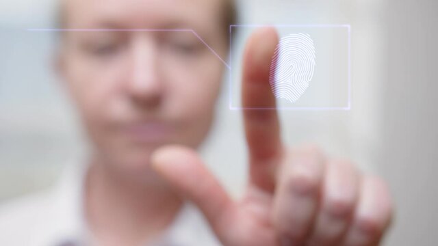 Fingerprint scan with biometric identification for secure access control. Woman puts her index finger on scanner for identity recognition. Advanced security systems.