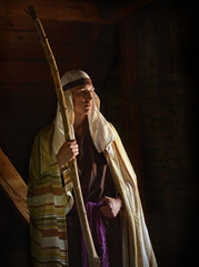 Ancient man with wooden wand