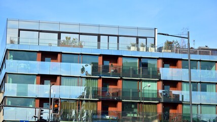 Facade of a modern apartment condominium in a sunny day © Grand Warszawski