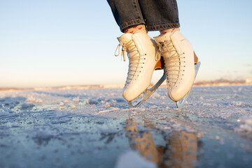 winter ice skating on a frozen lake. the concept of active recreation.