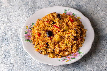 Traditional delicious Turkish food; Bulgur pilaf with eggplant and vegetables. (Turkish name; Patlicanli bulgur pilavi)