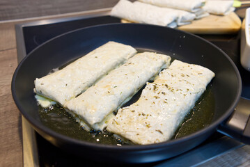 lavash appetizer fried in a pan. Snack for party with friends. close up