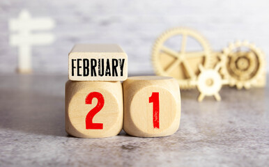 Day 21 of february month, Wooden calendar with date. Empty space for text