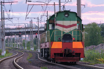 Fototapeta na wymiar Soviet powerful diesel locomotive on the railroad early morning. 