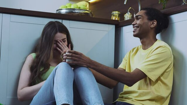 Modern multiethnic unstereotyped couple lifestyle moments at home. Not stereotyped boyfriend and girlfriend living together. True love concepts
