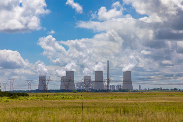 Coal power station near Vereeniging in South Africa. 
Electrical pylons in the foreground. 