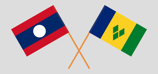 Crossed flags of Laos and Saint Vincent and the Grenadines. Official colors. Correct proportion