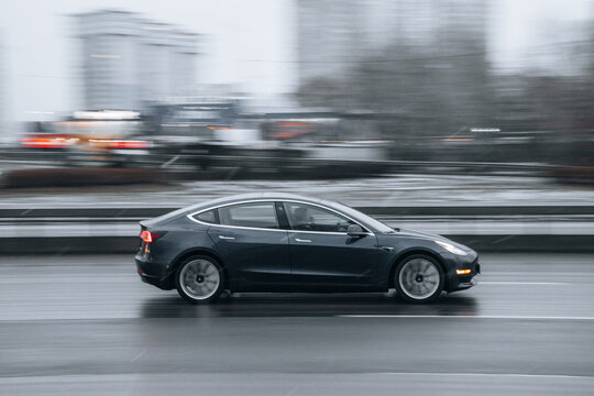 Ukraine, Kyiv - 15 January 2022: Gray TESLA Model 3 car moving on the street. Editorial