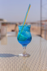 glass of Iced blue hawaii soda on table Blue Lagoon Cocktail