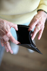 Female hands holding an empty wallet