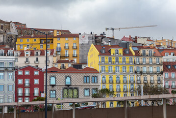 Facades of buildings in the city center of Lisbon fill the urban environment with historic and traditional architecture. Portugal.