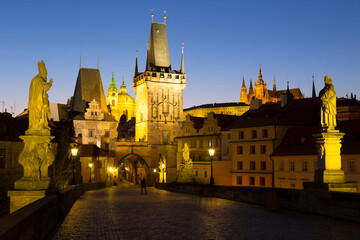Fototapeta na wymiar Night winter Prague Lesser Town with the gothic Castle from Charles Bridge above the River Vltava, Czech Republic