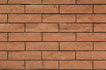 Laying bricks brown-orange. Wall, background, texture