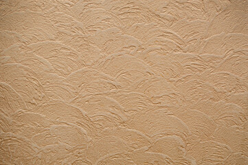 Beige wall texture with patterns. Background, texture, cement