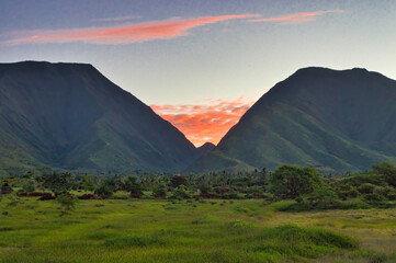 Lush green vallet at the west maui mountains at sunrise.