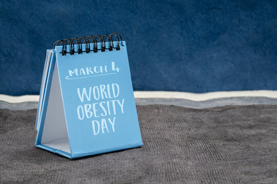 World Obesity Day, March 4 reminder - handwriting in a desktop calendar against abstract landscape, promoting practical solutions to end the global obesity and overweight crisis