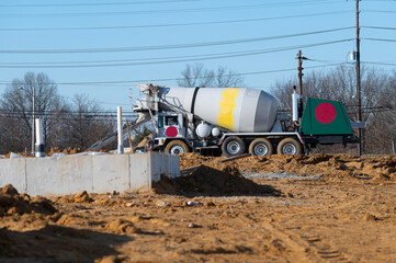 Concrete mixer truck pouring liquid concrete cement