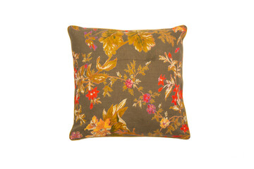 brown decorative pillow and floral print