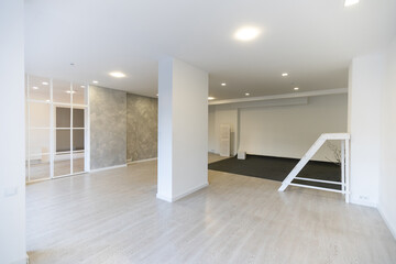 Fototapeta premium Bright empty office interior, white large office space.