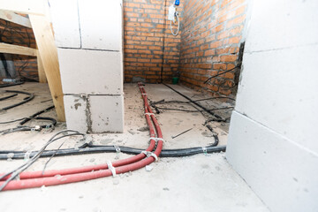 repair of wiring in the building. Electrical wires, wiring, socket on a building wall, home repair. cables.
