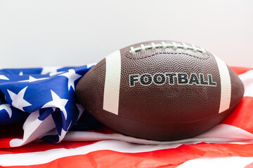 American football rugby ball against american flag