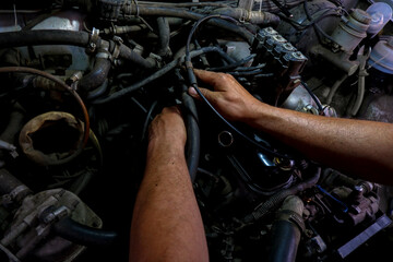Fototapeta na wymiar auto repair under the hood male hands dirty