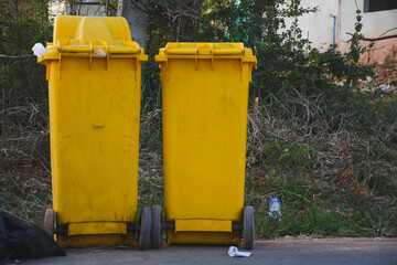 Fototapeta na wymiar yellow trash bin on the floor