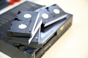 Video cassette tape VHS old retro style stack on video record player concept of vintage electric...