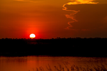 Fototapeta premium sunset or evening time over lake water.