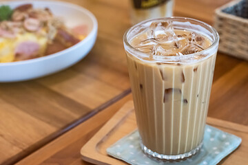 Coffee with ice in a clear glass Coffee is a drink in the daily life of many people. Some people need to drink up to 2 glasses a day
